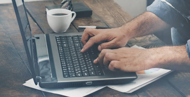 istock Male hands typing text on the laptop keyboard 811146114