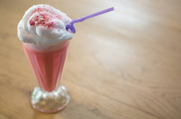 istock Glass of strawberry shake with cream 811165528