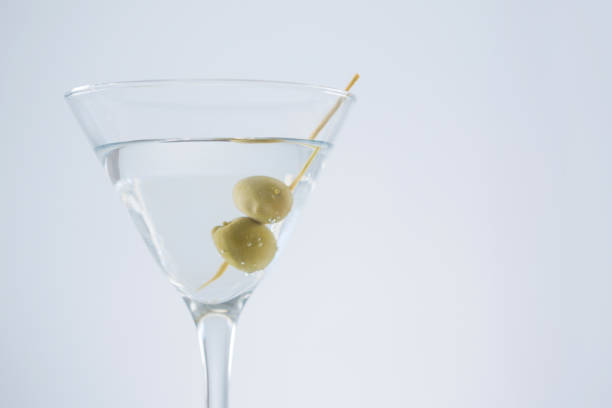 istock Cocktail martini with olives on table 811165640