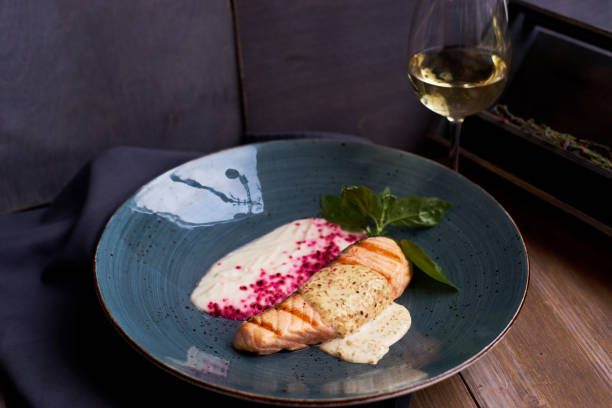 istock Grilled salmon steak on blue plate 811168074