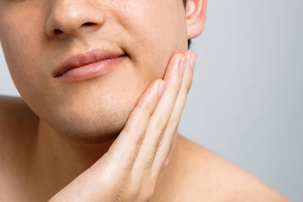 istock Close-up of a young man's mouth 811168546