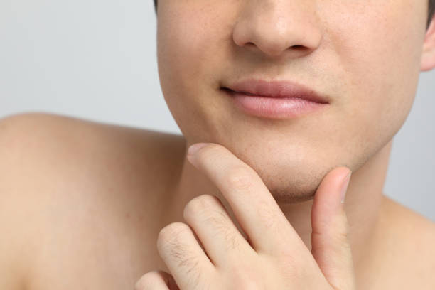 istock Close-up of a young man's mouth 811168556