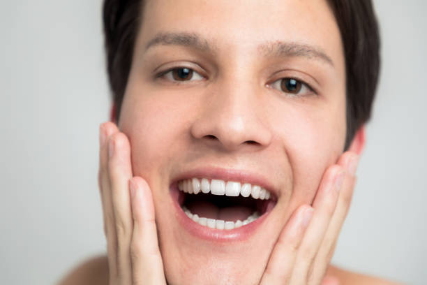 istock men's oral care concept. a man has regular teeth. 811168738