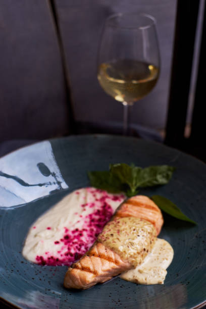 istock Grilled salmon steak on blue plate 811171248
