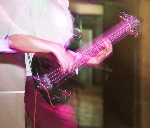 istock Musician playing guitar in a rock band 811174024