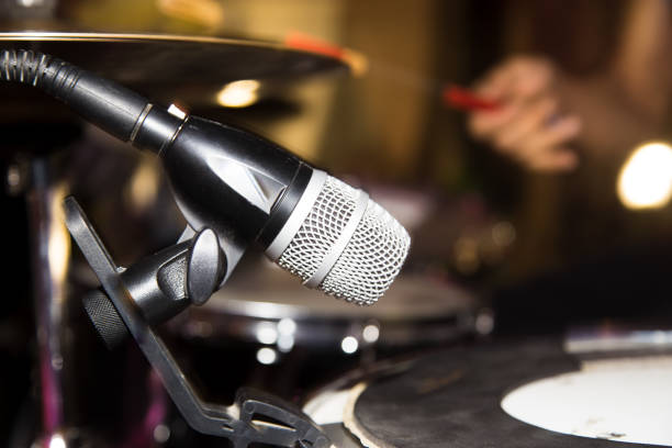 istock Microphone on the drums in the rock band 811176980