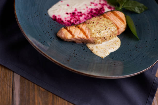 istock Grilled salmon steak on blue plate 811177050