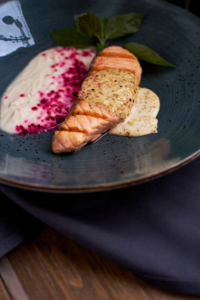 istock Grilled salmon steak on blue plate 811177096