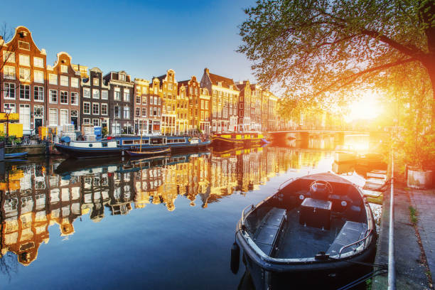 istock Amsterdam canal at sunset.  is the capital 811179556