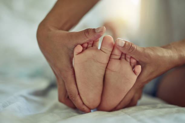 istock There's nothing quite so sweet as  tiny little baby feet 811195426