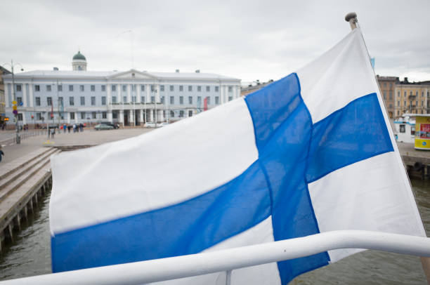 istock Finnish National Flag Flying on Boat in Harbour 811199286