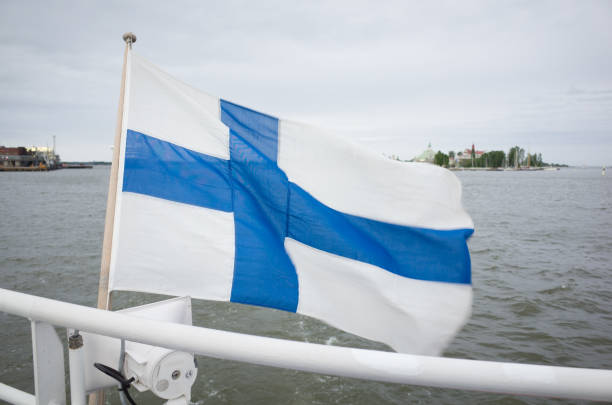 istock Finnish National Flag Flying on Boat in Harbour 811199302