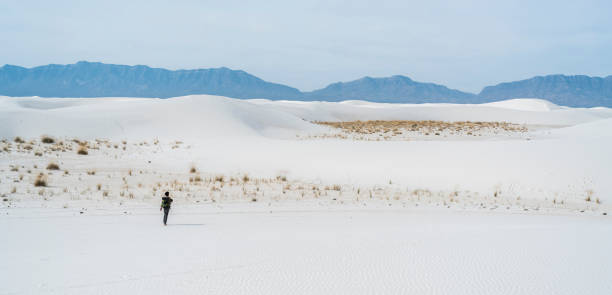 istock The young man, traveller, backpacker, exploring the White Sands National Monument, New Mexico 811214420