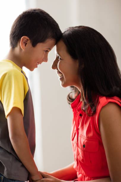 istock Happy mother and son smiling at each other 811215318