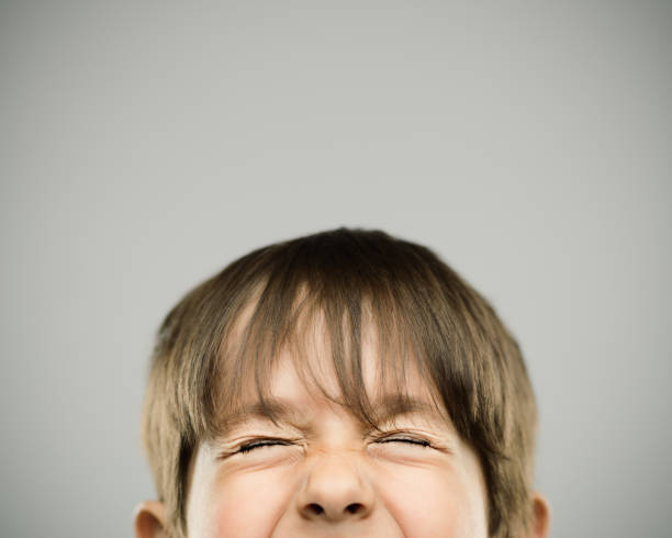istock Cute little boy closing eyes and smiling 811227282