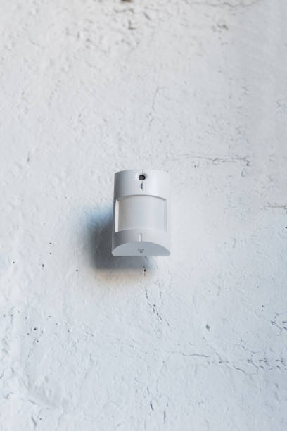 istock close up of one white motion sensor on white wall 811227566