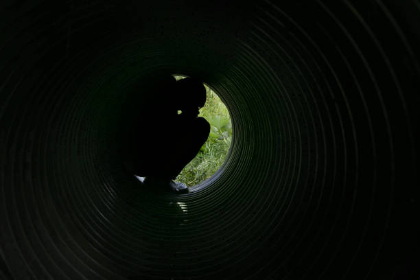istock Man thinking at the end big pipe near nature. 811241100