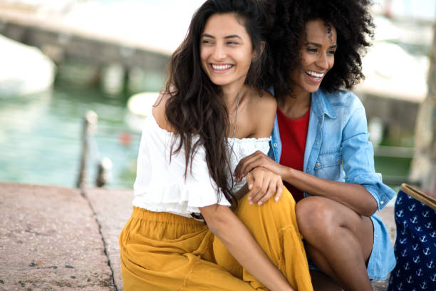 istock Two girl friends laughing. 811244078