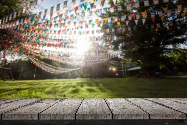 Empty wood Shelf on flags in garden background