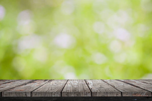istock Empty wood Shelf on green bokeh background 811250674