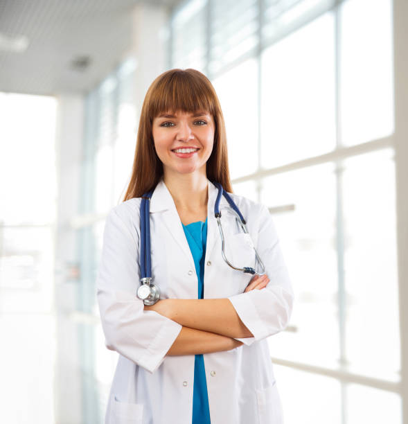 istock Happy female doctor smiling 811250850