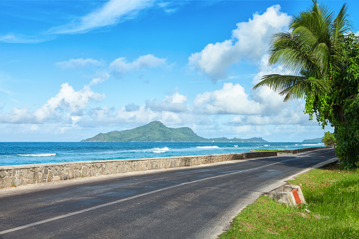 Road along the ocean's beach, Mahe, Seychelles.