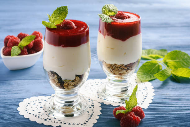 istock Healthy yogurt dessert with muesli and  raspberry mousse. 811255370