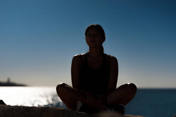 istock Beautiful sportswoman sitting at seaside 811258962