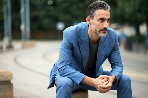 Portrait of mature handsome man looking away