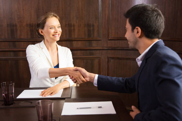 istock Happy business consultant greeting client 811264702