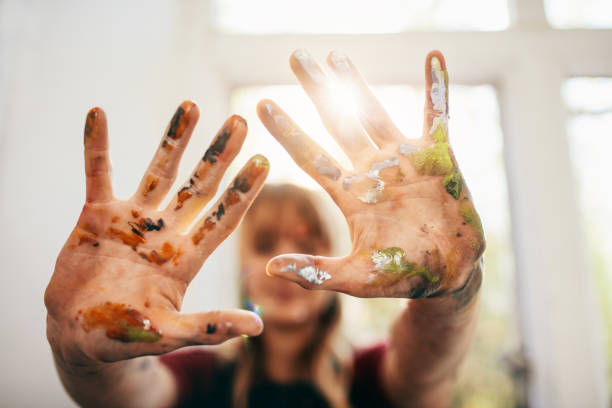 istock Messy hands of female painter 811264714