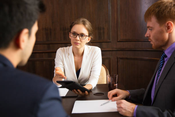 istock Serious businesswoman advancing argument 811264836