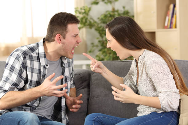 istock Couple arguing and screaming each other 811265012