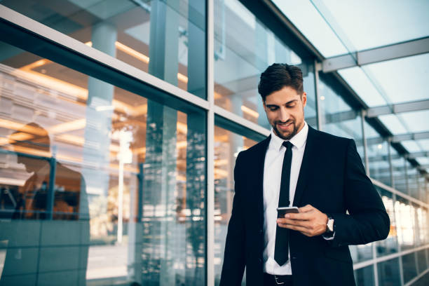 istock Business executive with mobile phone at airport 811269214