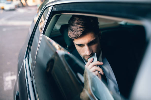 istock Male business executive travelling by a cab 811273650