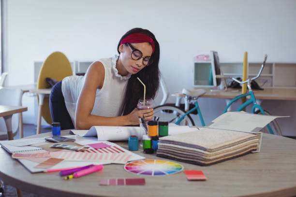 istock Focused businesswoman working in creative office 811273924
