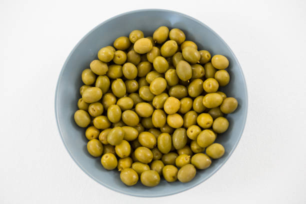 istock Close-up of marinated olives in bowl 811274086