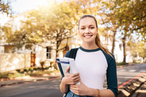 istock Female university student going to college 811274230