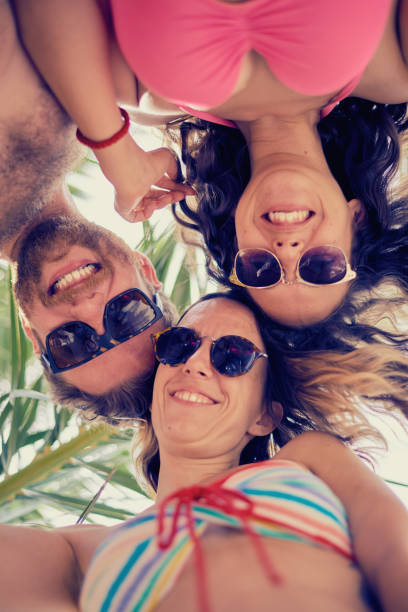 istock Friends having a good time at the beach 811274298