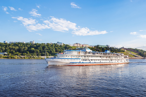 Passenger river boat on the background of the Nizhny Novgorod kremlin