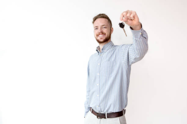 istock Happy sales manager holding car or house key 811285448