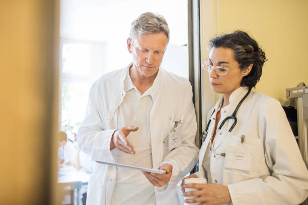 istock Two doctors discussing over digital tablet at the hospital 811286958