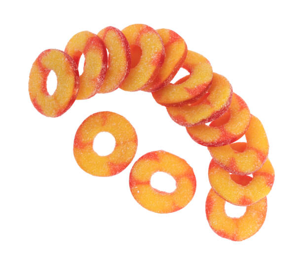 istock Peach flavored candy rings on a white background 811300146