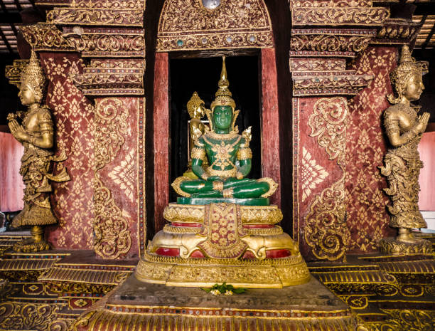 istock Green Buddha statue in Phra Singh Temple Chiang Mai Thailand 811300166