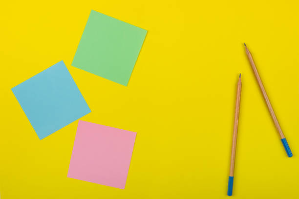 istock Colorful documents with copy space on a colored background. View from above. For notes and ideas. 811302822