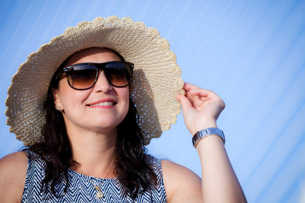 istock Smiling mature woman with hat 811302872