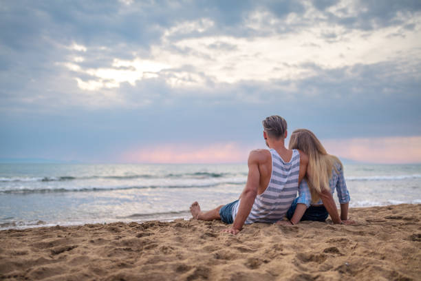 istock Young in love couple on the beach 811303006