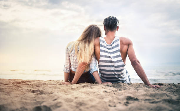 istock Happy couple date at the seaside at sunset 811303668