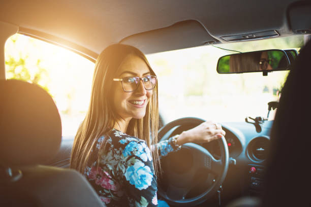 istock woman driving a car 811310296