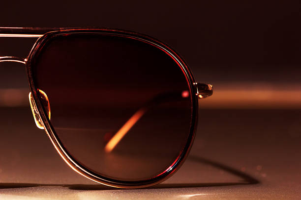 istock Sun glasses on the table close-up 811310968
